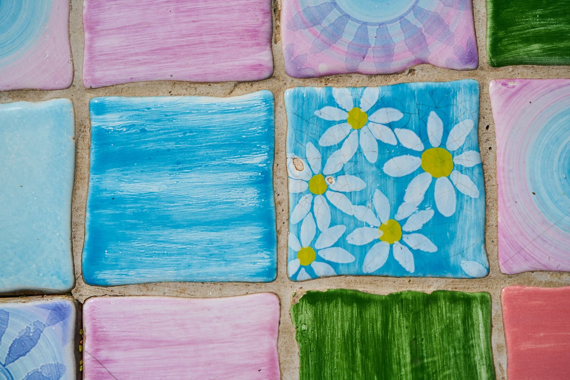 Vibrant hand-painted ceramic tiles with floral designs